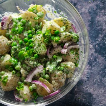 Potato salad with summery broad beans, peas and a lovely light lemon and dill dressing. No mayo. An excellent BBQ side and SO delicious with grilled fish or chicken.