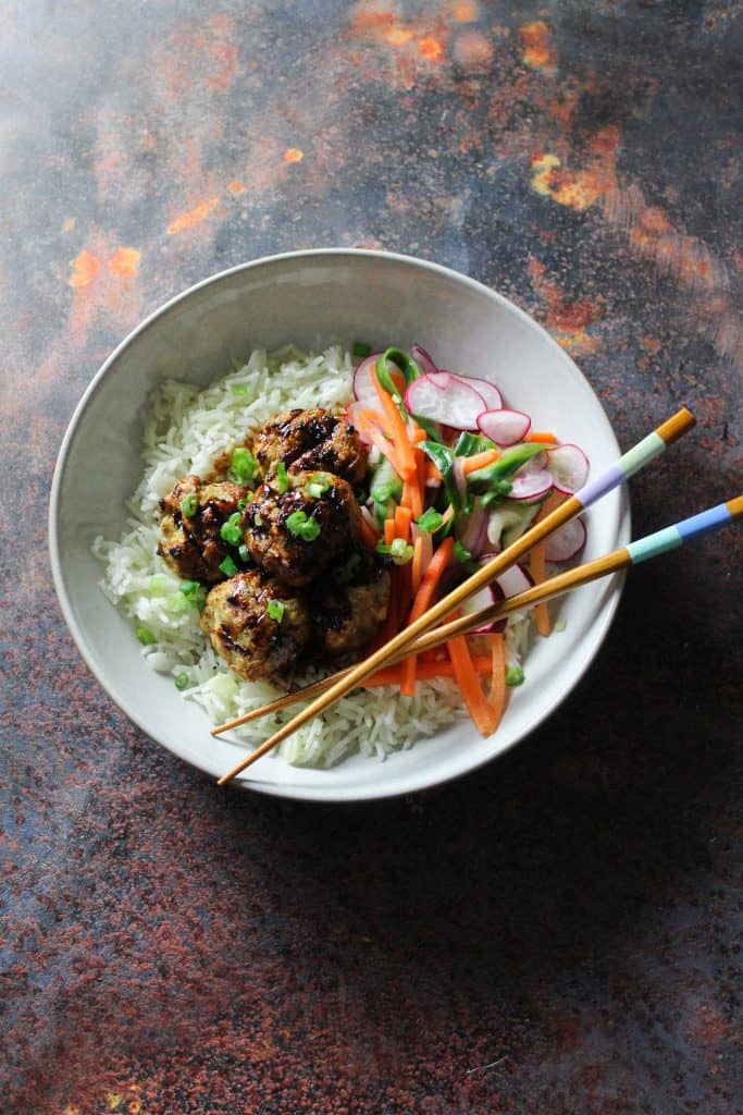 Delicious pork meatballs with a sticky soy, ginger and sweet chilli glaze, paired perfectly with a crunchy and tangy pickled slaw. 