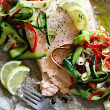 Super easy oven baked lemon Salmon fillet with a fresh Courgette and Pepper salad - the perfect light summer meal in under 30 minutes!