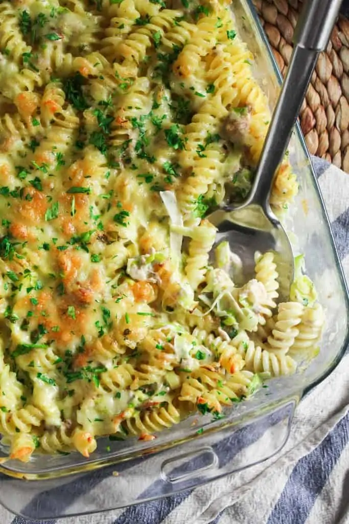 Closed up of baked fusilli pasta in a sauce made from heavy cream, canned tuna and sharp cheddar cheese.