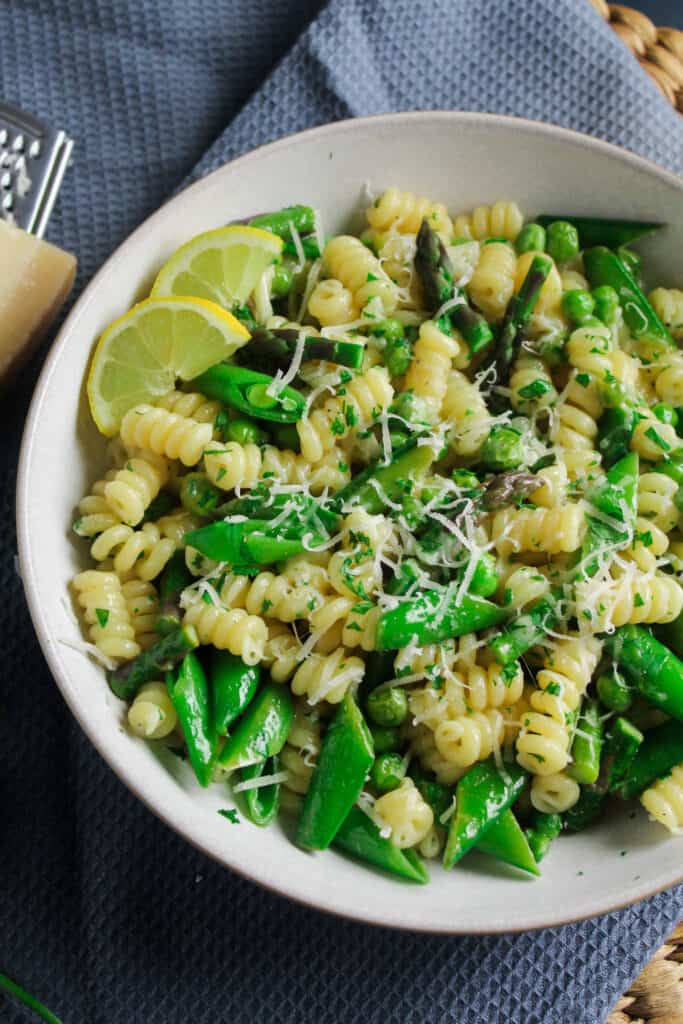 Close up of Spring Vegetable Pasta Primavera with peas and asparagus.