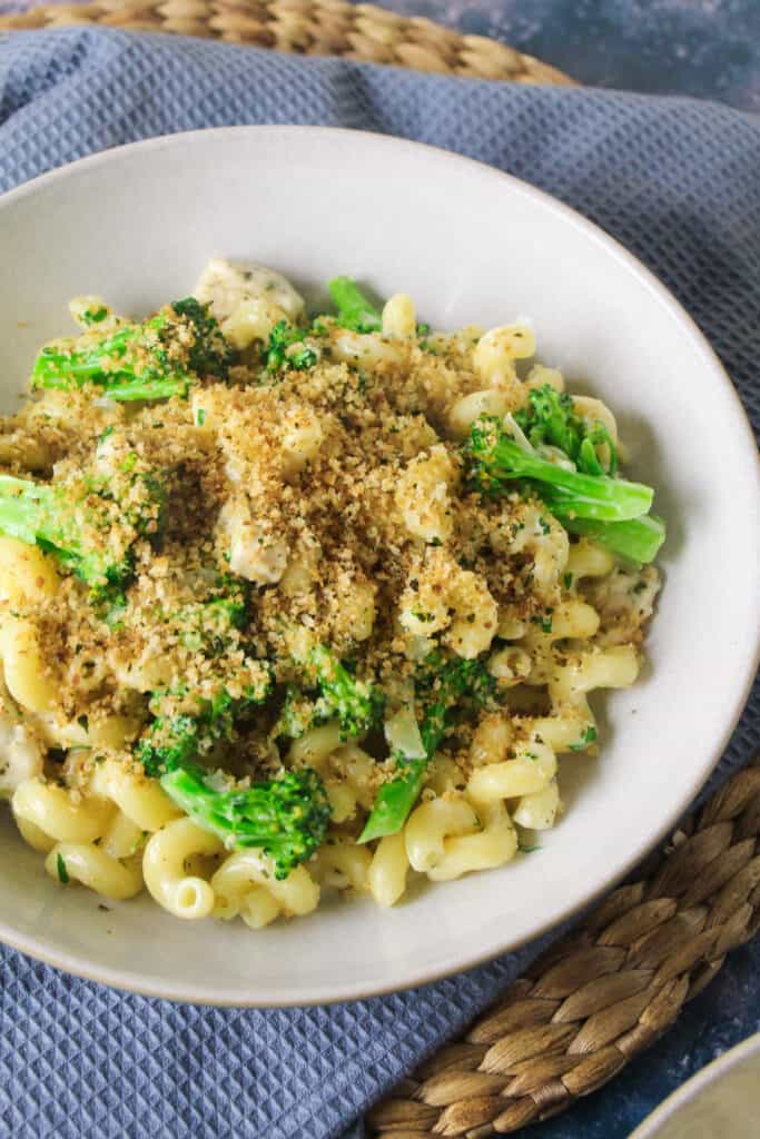 Close up of creamy chicken and broccoli pasta sprinkled with breadcrumbs.