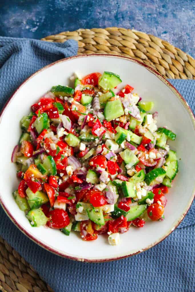 Chopped salad made from cucumber, tomato, red onion, red pepper and crumbled feta cheese. 