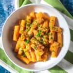 Pasta with lentil and sweet potato sauce and parmesan cheese.