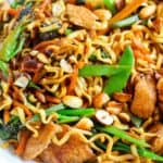 Lo Mein stir-fry with vegetables, chicken, and noodles in a savory sauce. Perfect for homemade Asian-inspired meals.