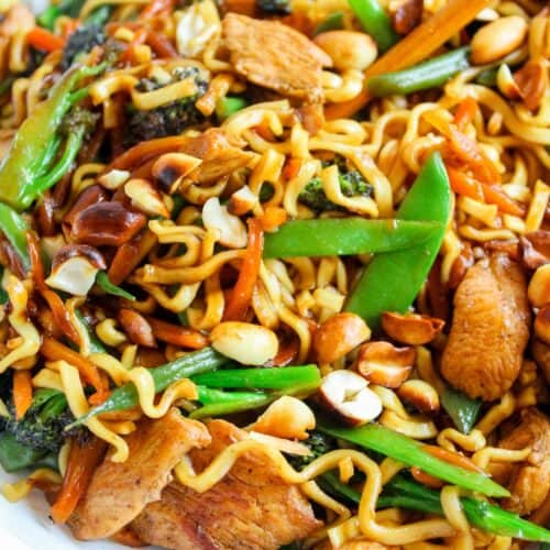 Lo Mein stir-fry with vegetables, chicken, and noodles in a savory sauce. Perfect for homemade Asian-inspired meals.