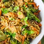 Chicken stir-fry with broccoli, carrots, and noodles for a healthy meal.