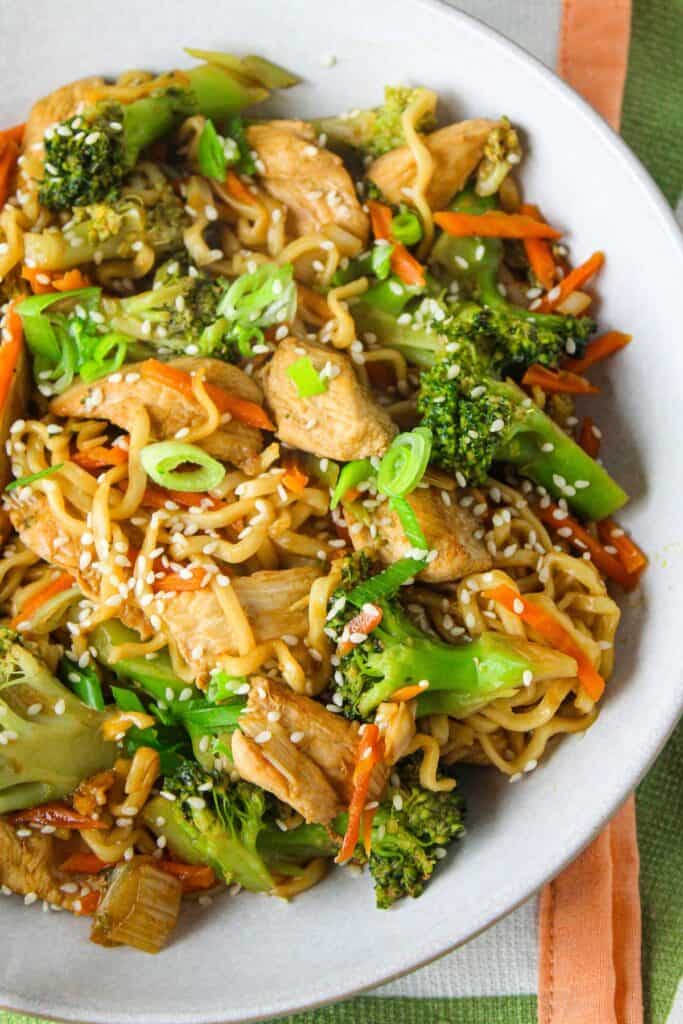Chicken stir-fry with broccoli, carrots, and noodles for a healthy meal.