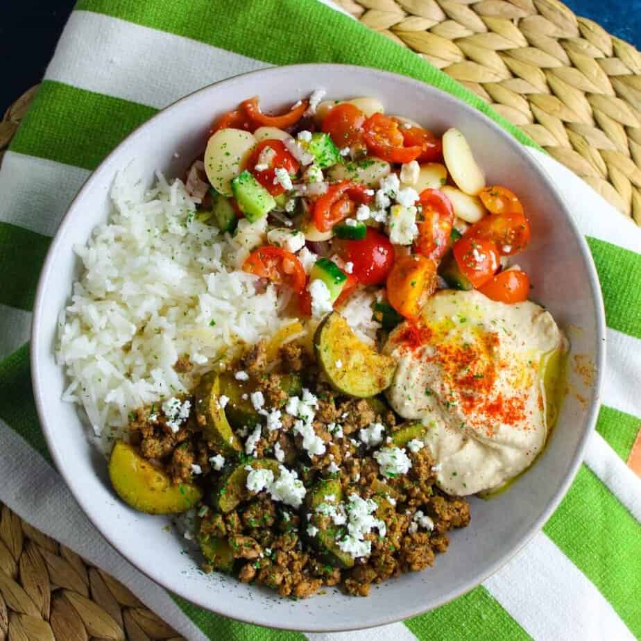 Mediterranean inspired beef and hummus bowls with rice and butter bean salad.