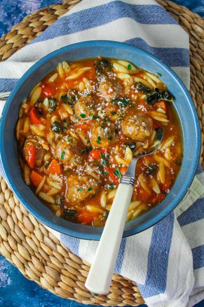 Meatballs and Orzo in broth.
