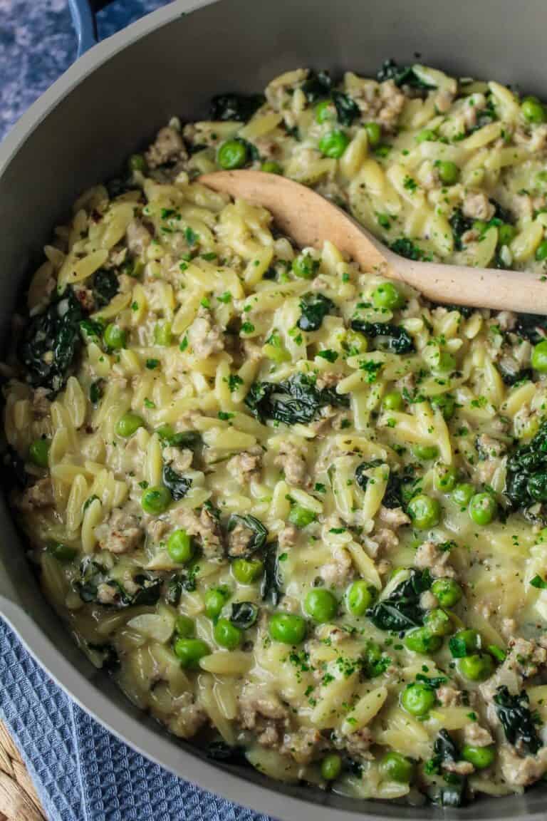 Creamy sausage orzo with peas and kale.